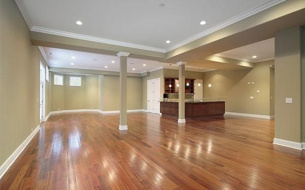 hardwood floors can be installed in a basement or a room with a concrete subfloor with proper preparation